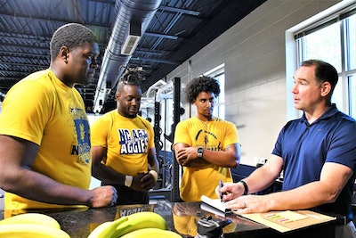 Student athletes Jason Ivey, Janorris Robertson, and Zach Yeager, and Dr. Troy Purdom